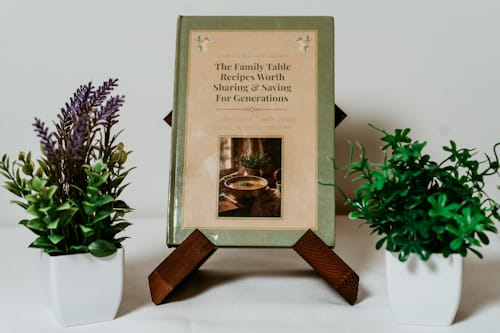 Tasteful Memories family cookbook displayed between plants